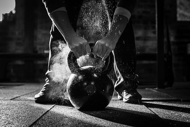 Person lifting a kettlebell